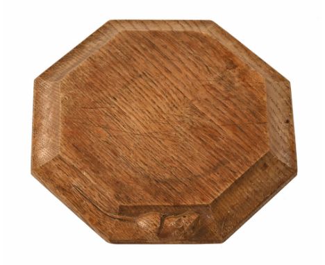 A Workshop of Robert Mouseman Thompson Kilburn, an oak teapot stand, width 19 cm.