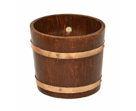 A Lister & Co Ltd Dursley oak and brass planter/waste paper bin.  Height 28 cm, diameter 32 cm.
