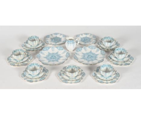 A Wileman & Co (Foley China Company) part tea set, with gilt and blue floral decoration and with scallop or petal shape, comp