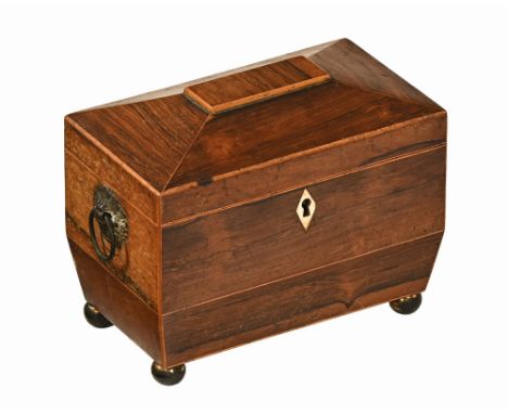 An early 19th century rosewood tea caddy, being boxwood strung and with bone lock escutcheon and brass carrying handle to eit