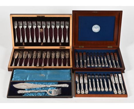 A mahogany cased set of twelve dessert knives and forks, with white metal handles, mahogany boxed set of twelve fish knives a