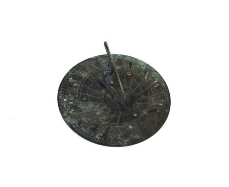 A vintage brass sundial, diameter 25 cm.   CONDITION REPORT:  The sundial is in good order.  It shows some discolouration fro