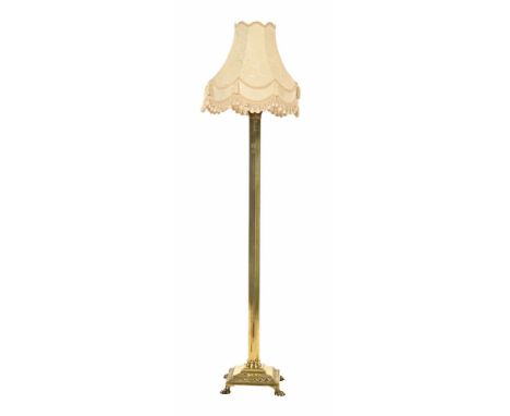 An early 20th century brass Corinthian column standard lamp, with tasselled shade.  Height excluding light fitting 126 cm.   