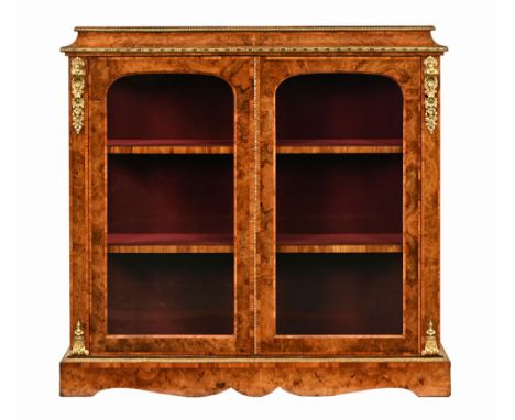 A Victorian walnut double pier cabinet, with crossbanded caddy top metal mounts and plinth base.  Height 123 cm, width 127 cm