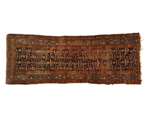 A Persian design runner, with multiple line border and centre rectangular panel, principal colours dark blue, red, light blue