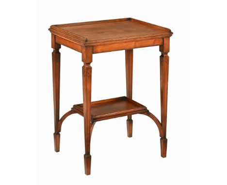An Edwardian walnut side table, with three quarter gallery raised on incised tapered legs of square section terminating in sp