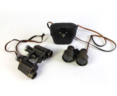 A pair of First World War period binoculars, and another smaller pair, cased.   CONDITION REPORT:  There are no broad arrow m