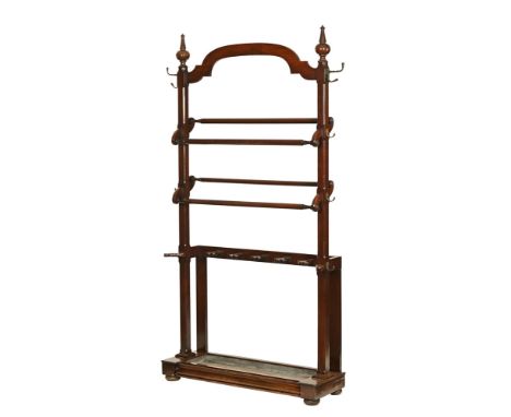 A 19th century mahogany hall stand, of large proportions having finial and scroll top over chamfered frame and rails with sha