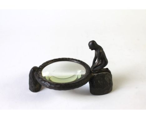 An Art Deco Bausche Lomb nude girl magnifying glass, marked Rochester New York, No. 81359.  Height of figure +/- 9 cm, diamet