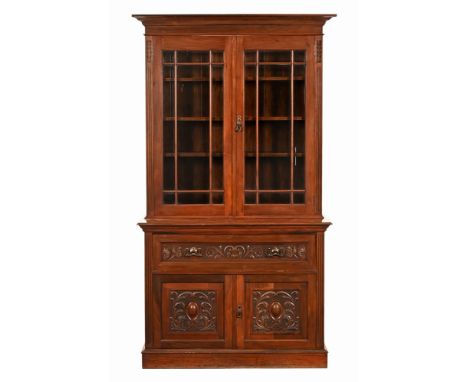 An Edwardian walnut secretaire bookcase, with detachable cornice above a pair of glazed doors.  The base with secretaire draw