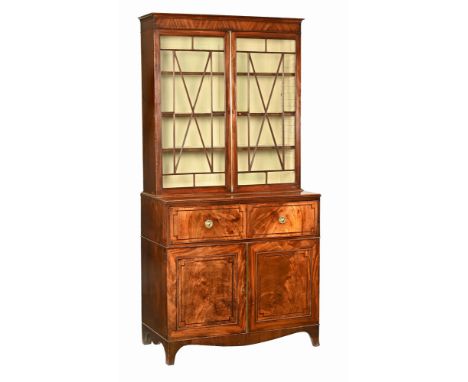 A George III mahogany secretaire bookcase, with moulded cornice above a pair of glazed doors with wooden astragals opening to