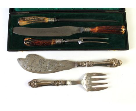 A cased antler carving set W.R.H. & Company Sheffield England and fish servers.  This bladed product is not for sale to peopl