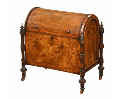 A Victorian walnut cylinder top Canterbury, with turned columns to each corner and raised on ceramic castors.  Height 54 cm, 