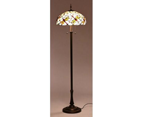 A Tiffany style standard lamp, the glazed shade decorated with dragonflies.  Overall height 167 cm.   CONDITION REPORT:  The 