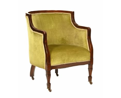 An Edwardian inlaid tub chair, upholstered in green material and raised on tapered legs of square section terminating in bras
