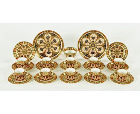 A Royal Crown Derby tea set, comprising 2 large dished plates, 10 cups, 10 saucers, 12 side plates and sugar basin, mostly ma