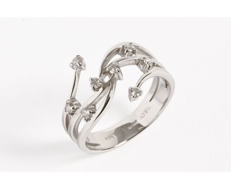 An 18 ct white gold and diamond ring, with spray set diamond design.  Size M.   CONDITION REPORT:  The ring is in generally v