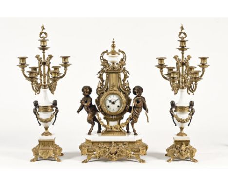 20th century brass and marble mantel clock, with enamelled face marked Imperial Made Italy, decorated with cherubs.  Height 6