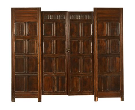 Four sections of antique oak panelling, the two largest 190 cm x 60 cm with later rear bracing frames.  NOTE:  the panels wer