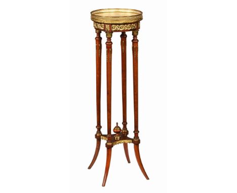 A Louis XVI style plant stand, with brass gallery and marble top raised on four fluted supports and downswept legs.  Height 1