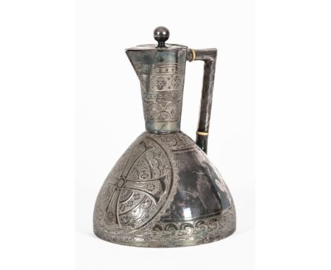 Squat form silver plated Christopher Dresser jug, with crucifix etched design.  Height 22 cm. NOTE:  This item has been assig