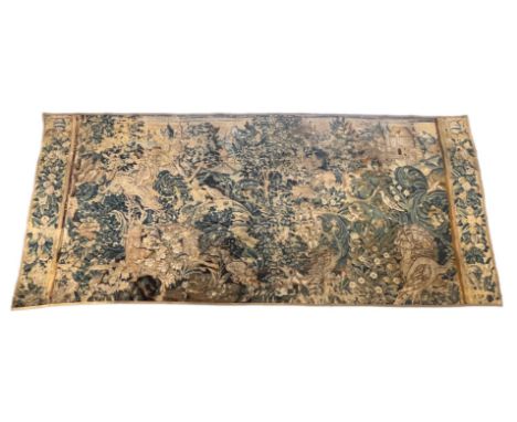 A 17th century Flemish verdure tapestry depicting a huntsman, stag and mythical beasts in a wooded landscape, château in the 