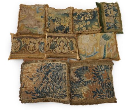 A four pairs of tapestry cushions and a similar single cushion, all made from fragments of 18th century Flemish verdure  and 