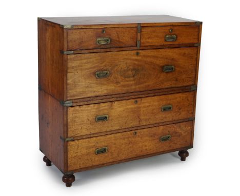 A Victorian teak campaign chest fitted two short and three long drawers, on turned feet, 99cm wide, 45cm deep, 101cm high Hon