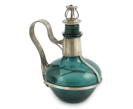 A Guild of Handicraft Ltd silver mounted decanter designed by Charles Robert Ashbee, the Whitefriars green glass of ovoid for