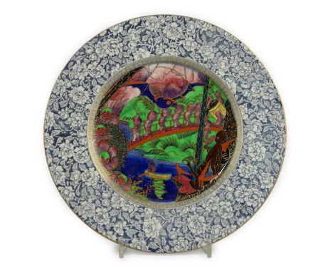 A Wedgwood Fairyland lustre ‘Lincoln’ plate, designed by Daisy Makeig Jones, decorated in the Roc design to the centre within