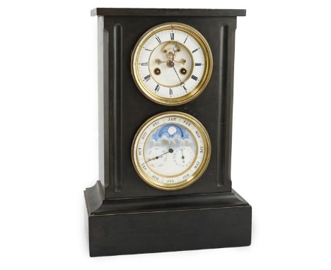 A late 19th century French black slate calendar mantel clock, the upper dial with enamelled Roman numerals and visible escape