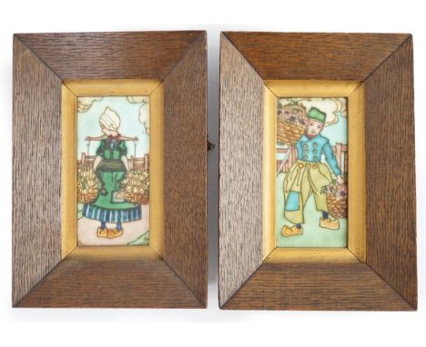 A pair of Charlotte Rhead 'Dutch' tiles, decorated with children carrying baskets of flowers, in original oak frames, 7cm wid