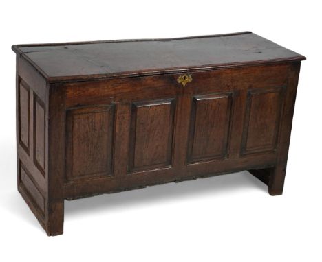 A 17th century panelled oak coffer with plain single plank top and fielded panelled sides, on stile feet, 151cm wide, 57cm de