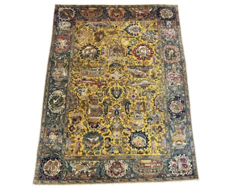 A Tabriz gold ground carpet with field of stylised figures, vases, birds and flowers on a gold ground within a matching medal