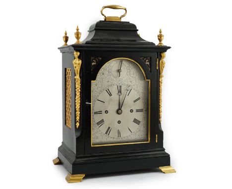 A Victorian ormolu mounted ebonised chiming bracket clock in traditional case with arched silvered Roman dial and chime / sil
