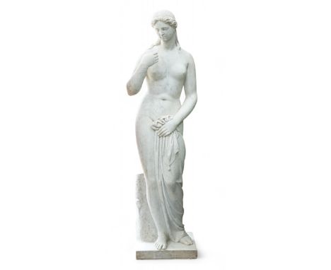 After the Antique. A large carved marble figure of Venus, standing beside a tree trunk, 141cm high Honest but weathered condi