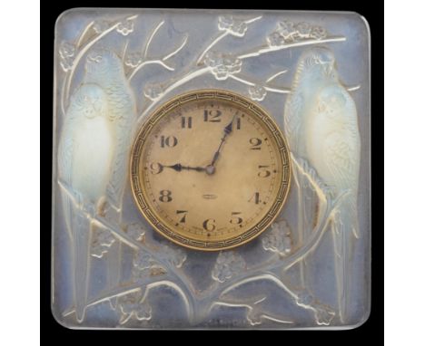 A R. Lalique Quatre Perruches opalescent glass strut timepiece, moulded mark R Lalique, 11.2cm high A little grubby so would 