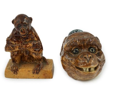A Clapham Common pottery figure of a seated monkey by J. Frisby Jordan, c.1925, and a stoneware monkey head flask, by JP, the