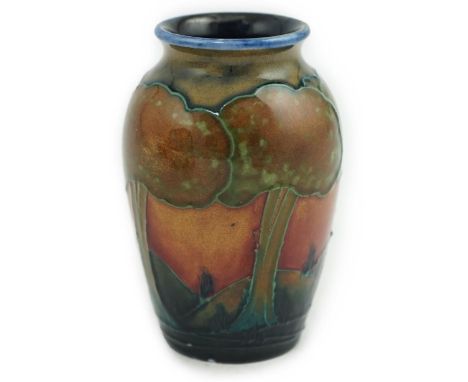 A Moorcroft Eventide small ovoid vase, c.1925, impressed marks and decorator’s mark, 9cm high There is a minute loss to the g