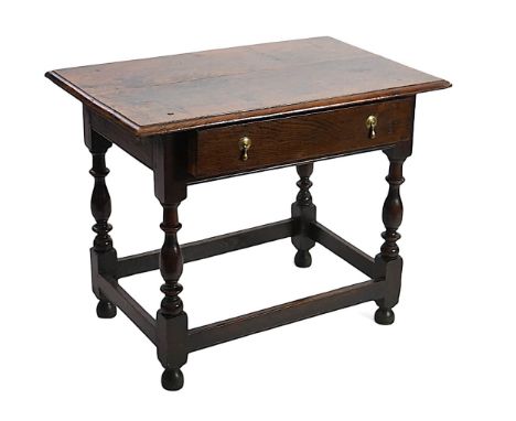 An early 18th century and later oak side table with moulded rectangular top over a frieze drawer, on baluster legs with squar