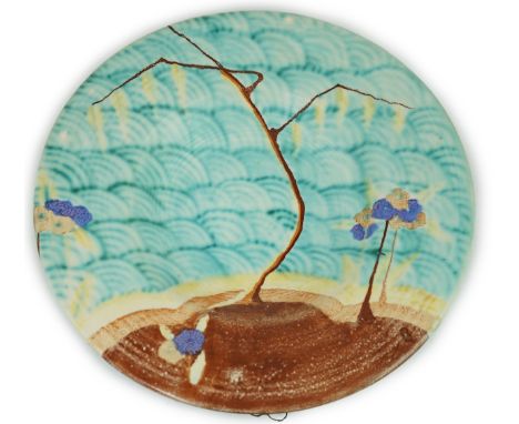 A Clarice Cliff 'Inspiration' footed charger, decorated with a sapling against a background of stylised waves and further tre