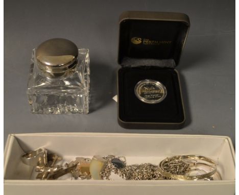 A silver Christening bangle; another; a sterling silver ring; another; a silver fob, Birmingham; an inkwell; a novelty South 
