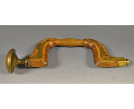 A brass plated beech button pad brace