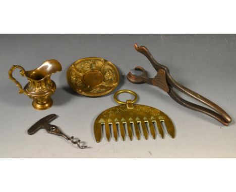 A gilt metal novelty miniature jug and bowl; a trench art curry comb; a corkscrew (3)