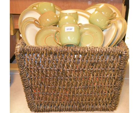 A Denby manor green dinner and tea service for six in a dark seagrass basket 