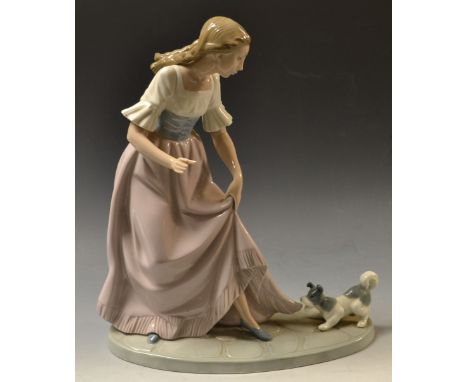A Nao figure, Terrier at foot, brown printed marks 