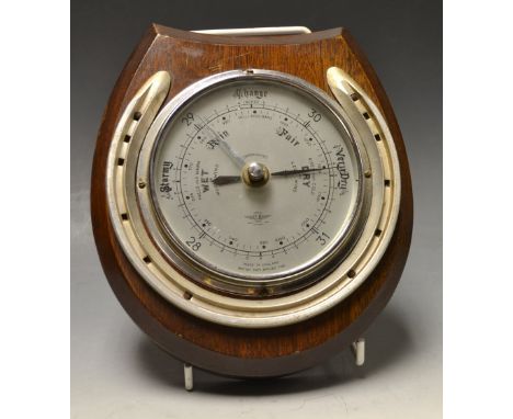 A mahogany novelty aneroid barometer, applied with a horseshoe