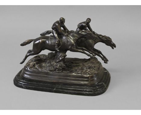A 19TH CENTURY STYLE BRONZE OF RACING JOCKEYS, two racing jockeys jumping a fence, cast and patinated on a naturalistic base 