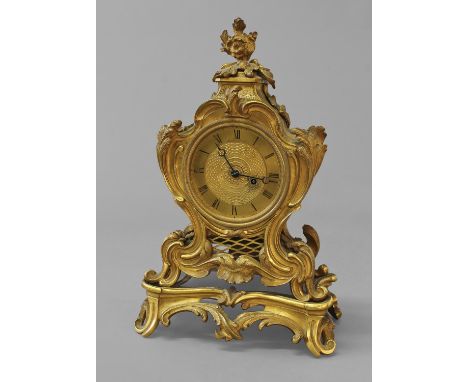 A 19TH CENTURY ROCOCO REVIVAL ORMOLU MANTEL CLOCK BY DES GRANGES, LONDON, the rococo revival case of scrolling waisted form, 