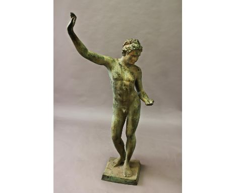 A CLASSICAL STYLE BRONZE STATUE OF A MALE FIGURE, the faun standing, naked, with one hand raised and the other held in front 